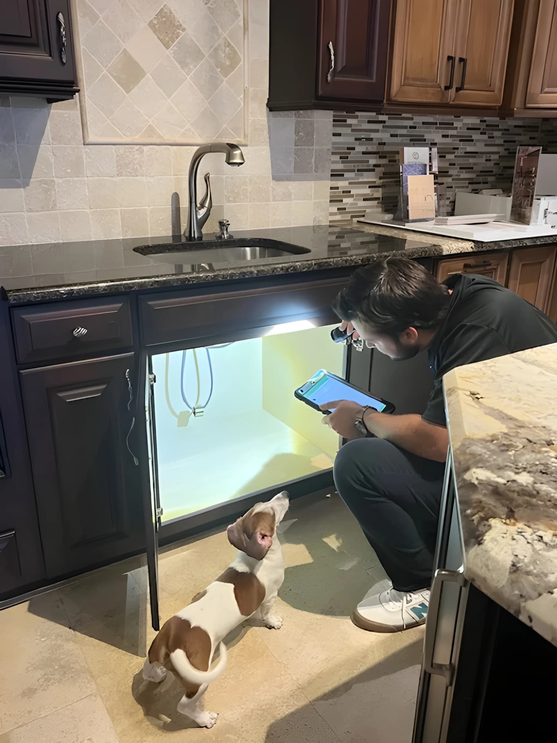 DryZone technician performing water damage restoration in a Southwest Florida home
